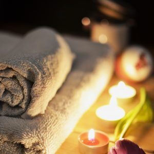 Spa Pampering Session with Towel and Candles